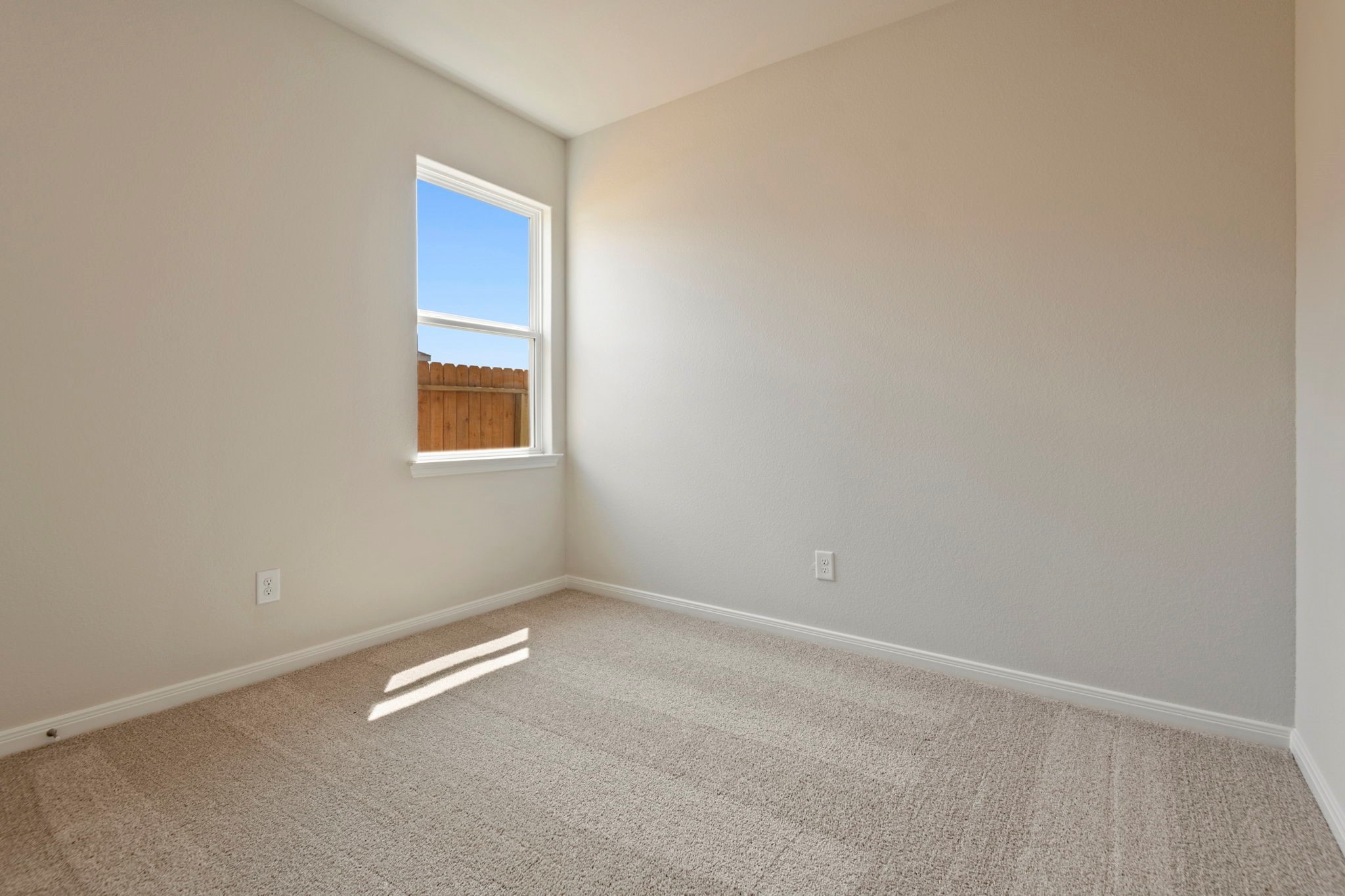 10351 Red Cardinal Drive Cleveland, TX 77328 - Photo 14 of 25 a view of an empty room with a window