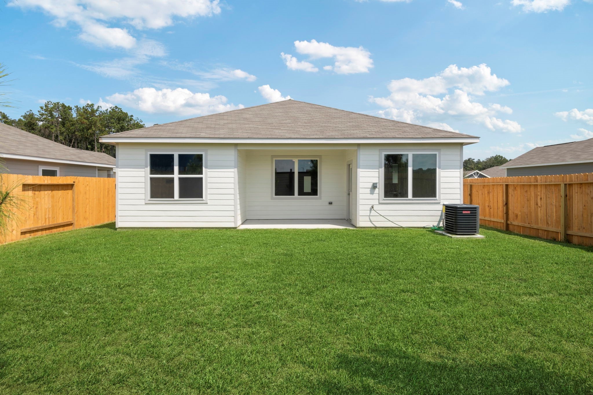 10351 Red Cardinal Drive Cleveland, TX 77328 - Photo 2 of 25 a house view with a garden space