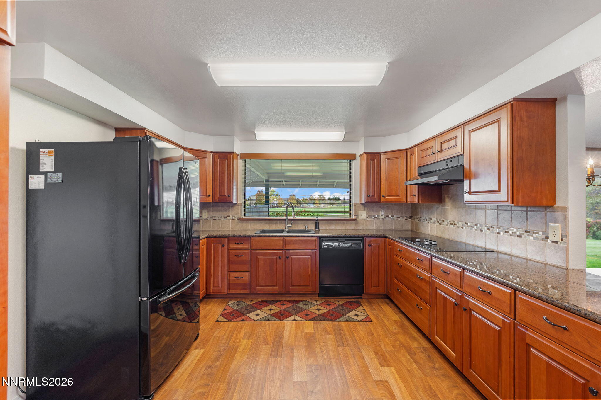 4045 Inverness Drive Reno, NV 89502 - Photo 12 of 34 Kitchen - Cooktop & Fairway Views