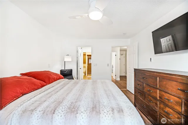 a bedroom with a bed and a dresser