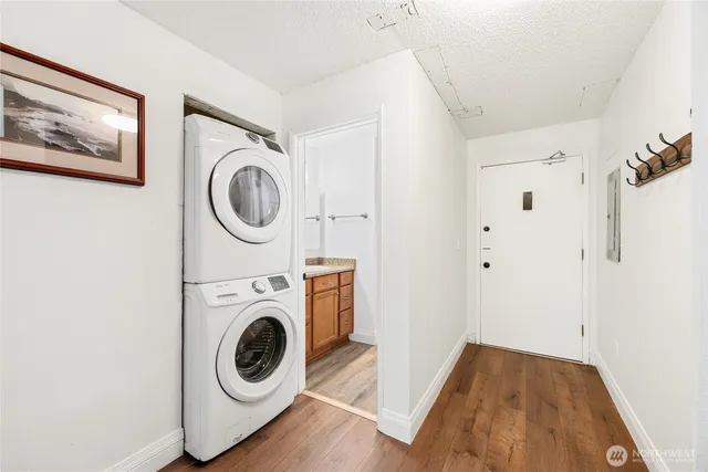 a view of a hallway with washer and dryer