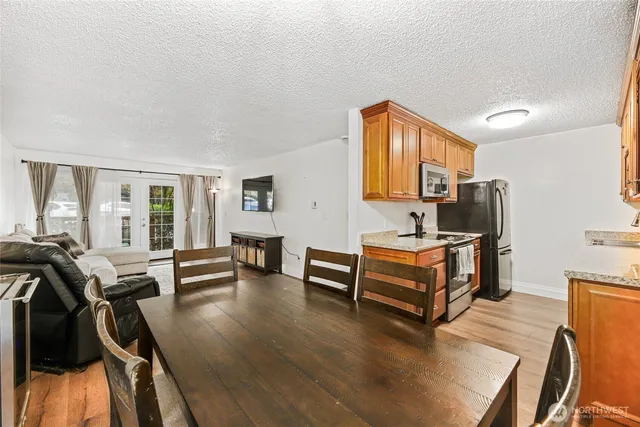 a bedroom with furniture and a wooden floor