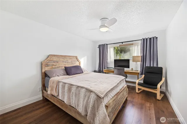 a bedroom with a bed and a table