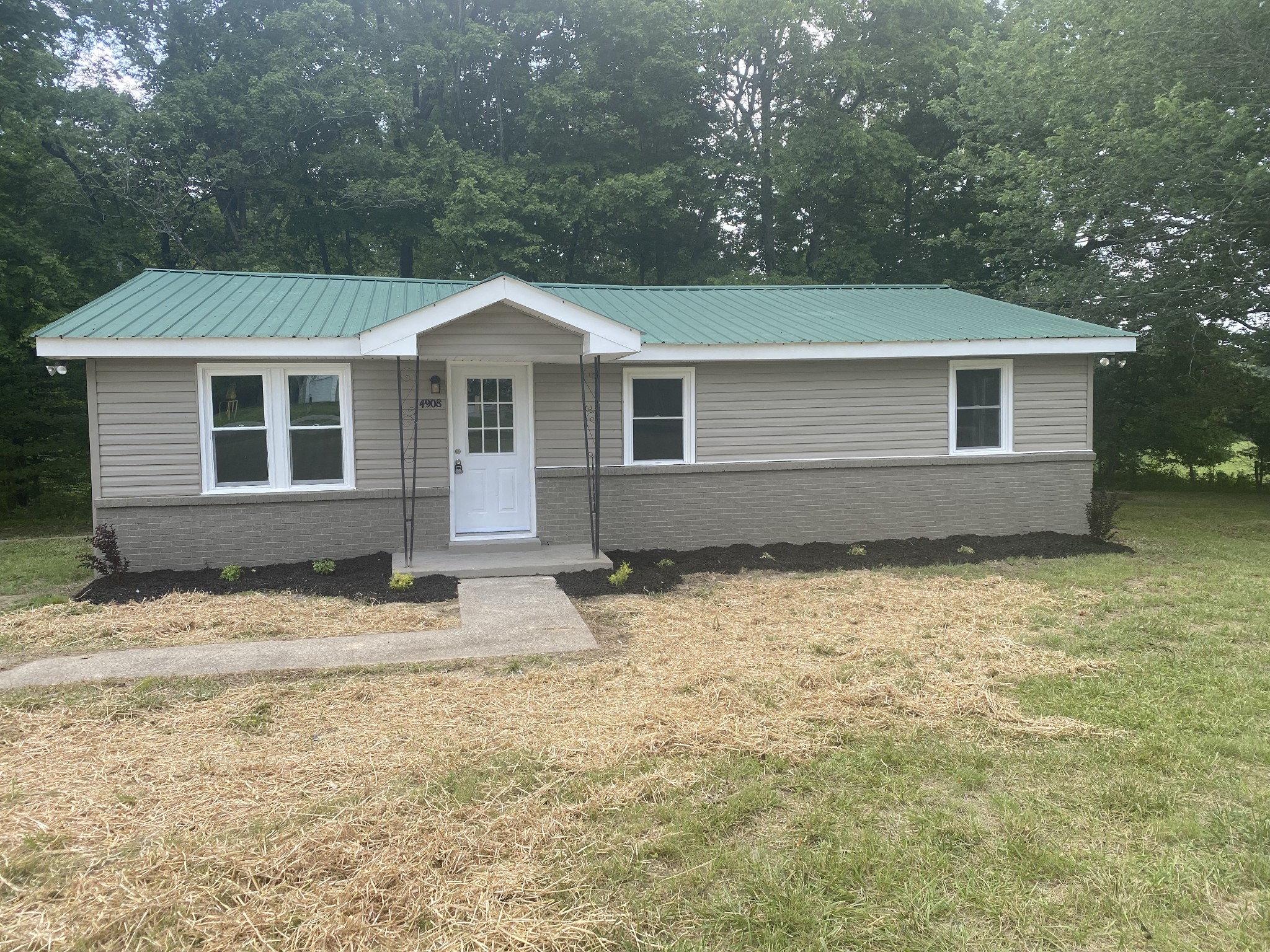 4908 Marion Road Cunningham, TN 37052 - Photo 1 of 27 a front view of a house with a yard