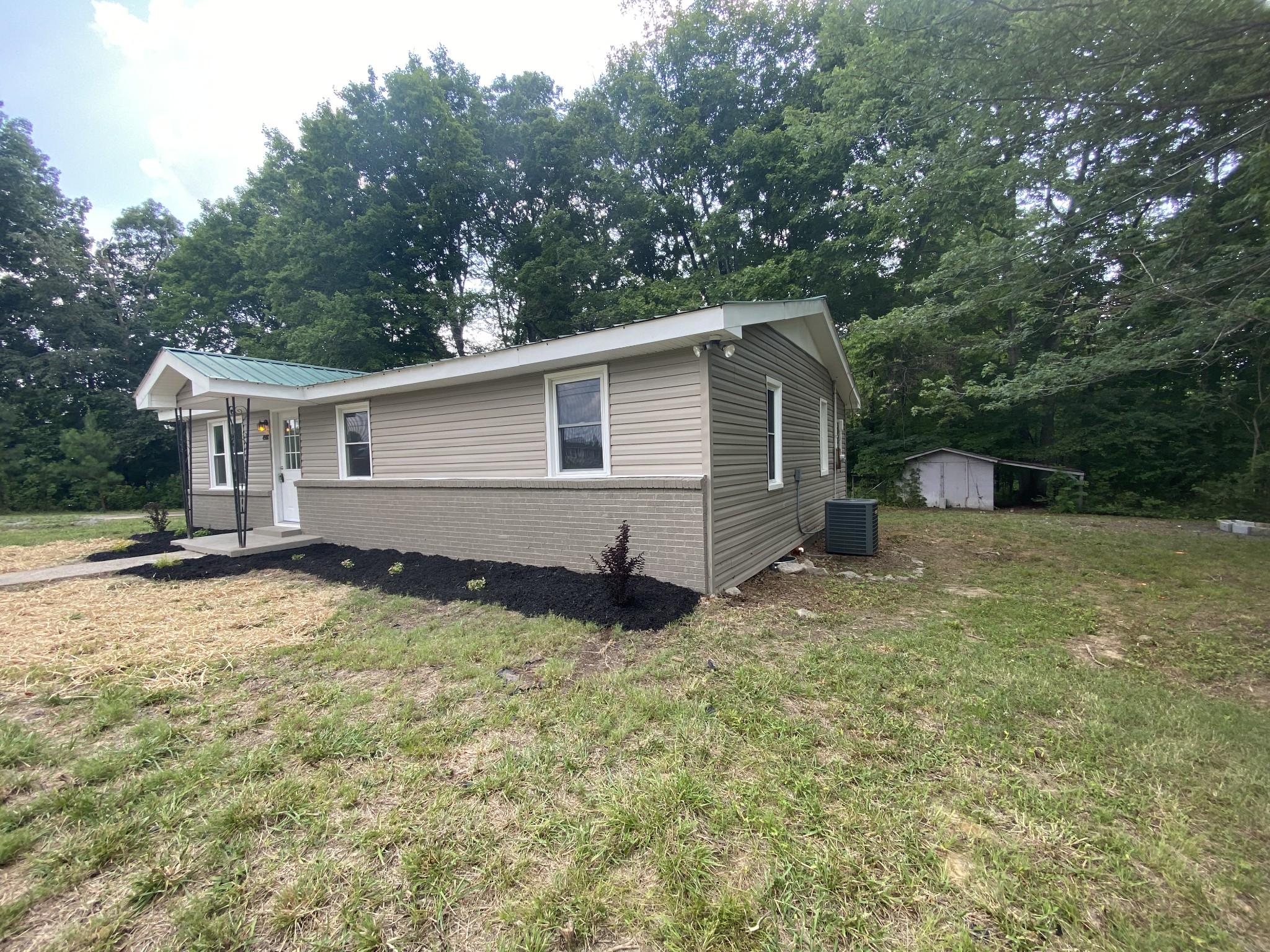 4908 Marion Road Cunningham, TN 37052 - Photo 11 of 27 a view of a house with a yard