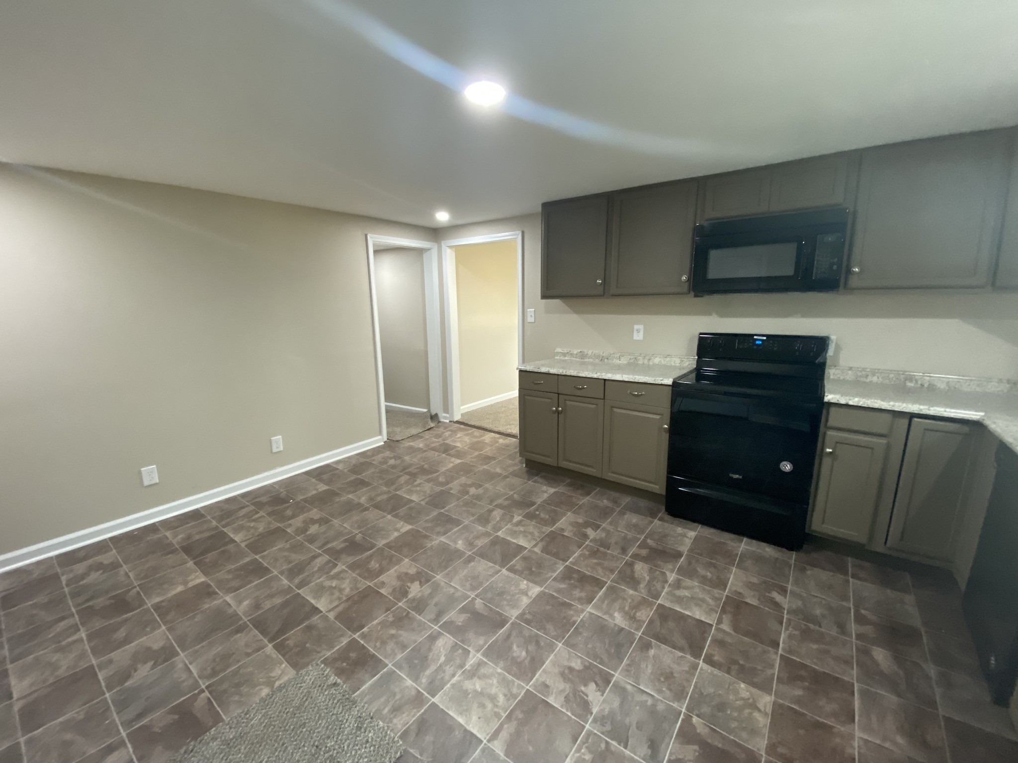 4908 Marion Road Cunningham, TN 37052 - Photo 20 of 27 a kitchen with stainless steel appliances a cabinets and a stove top oven