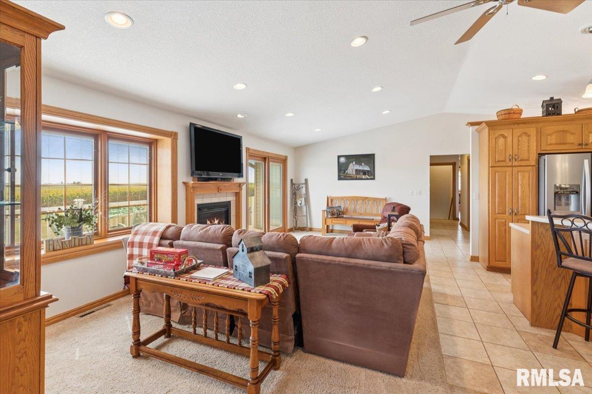 3983 120th Street Bryant, IA 52727 - Photo 19 of 62 a living room with furniture fireplace and a flat screen tv