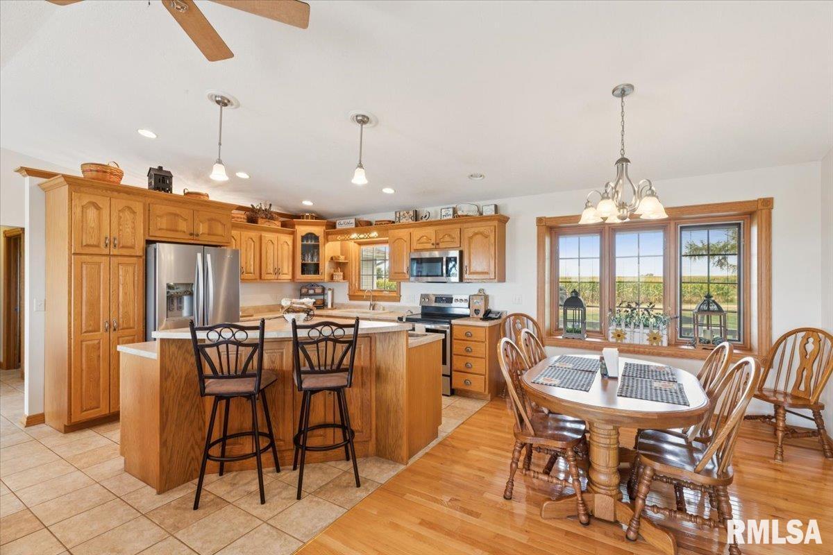 3983 120th Street Bryant, IA 52727 - Photo 21 of 62 a view of a dining room with furniture window and outside view