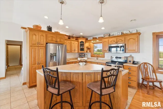 a kitchen with a sink a stove and cabinets