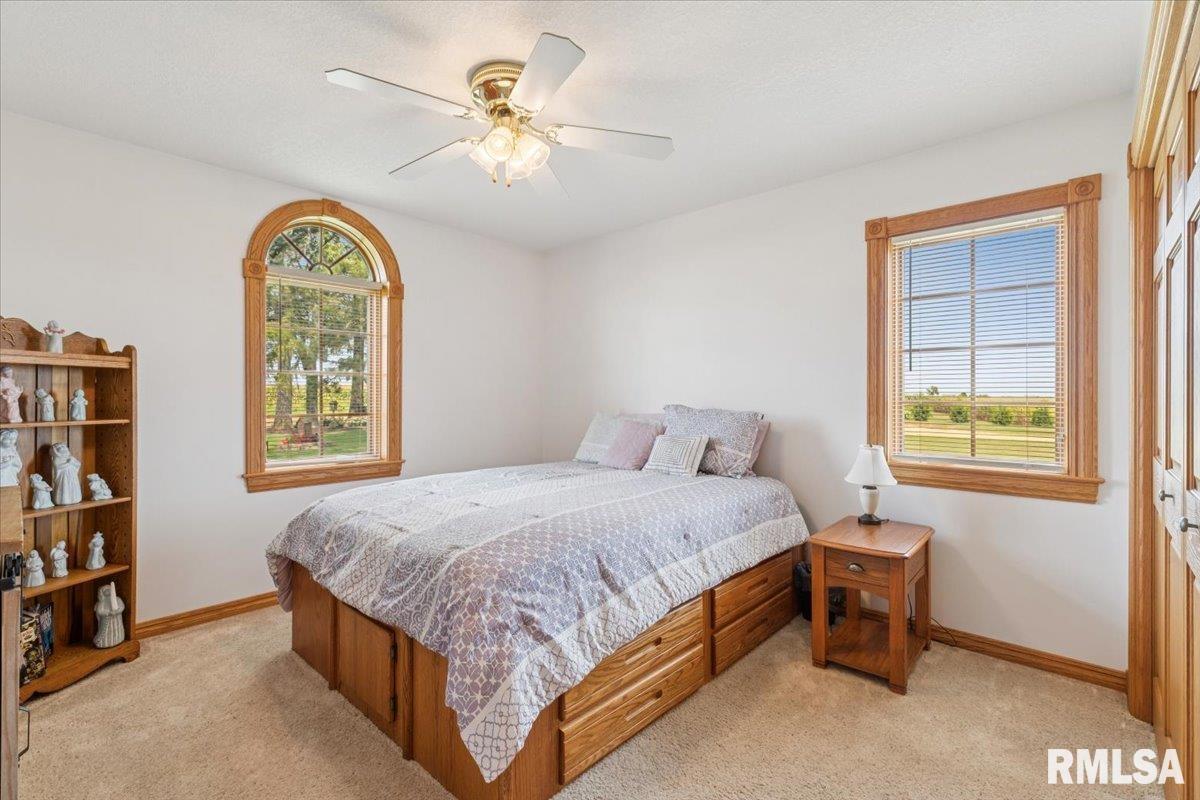 3983 120th Street Bryant, IA 52727 - Photo 29 of 62 a bedroom with a bed and a window