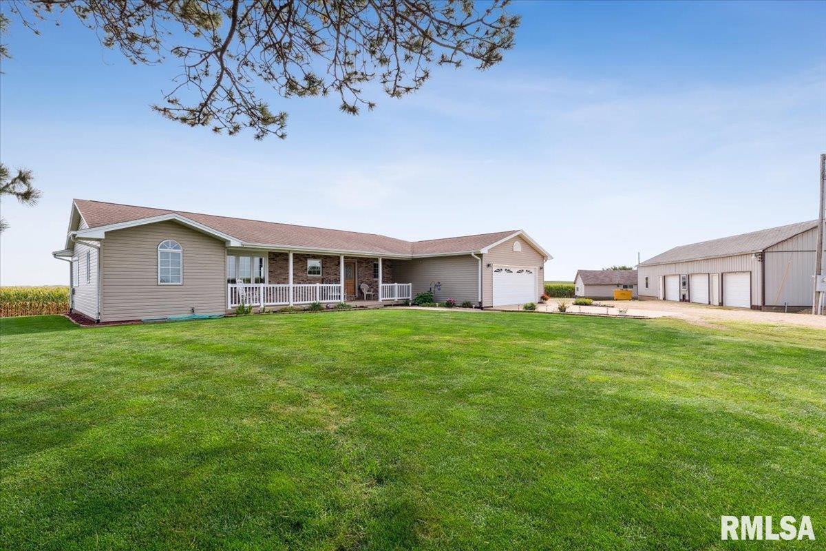 3983 120th Street Bryant, IA 52727 - Photo 3 of 62 a view of a house with a backyard