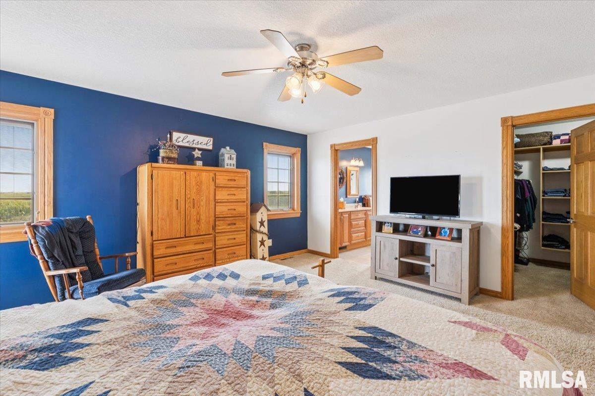 3983 120th Street Bryant, IA 52727 - Photo 34 of 62 a bedroom with a bed and a television