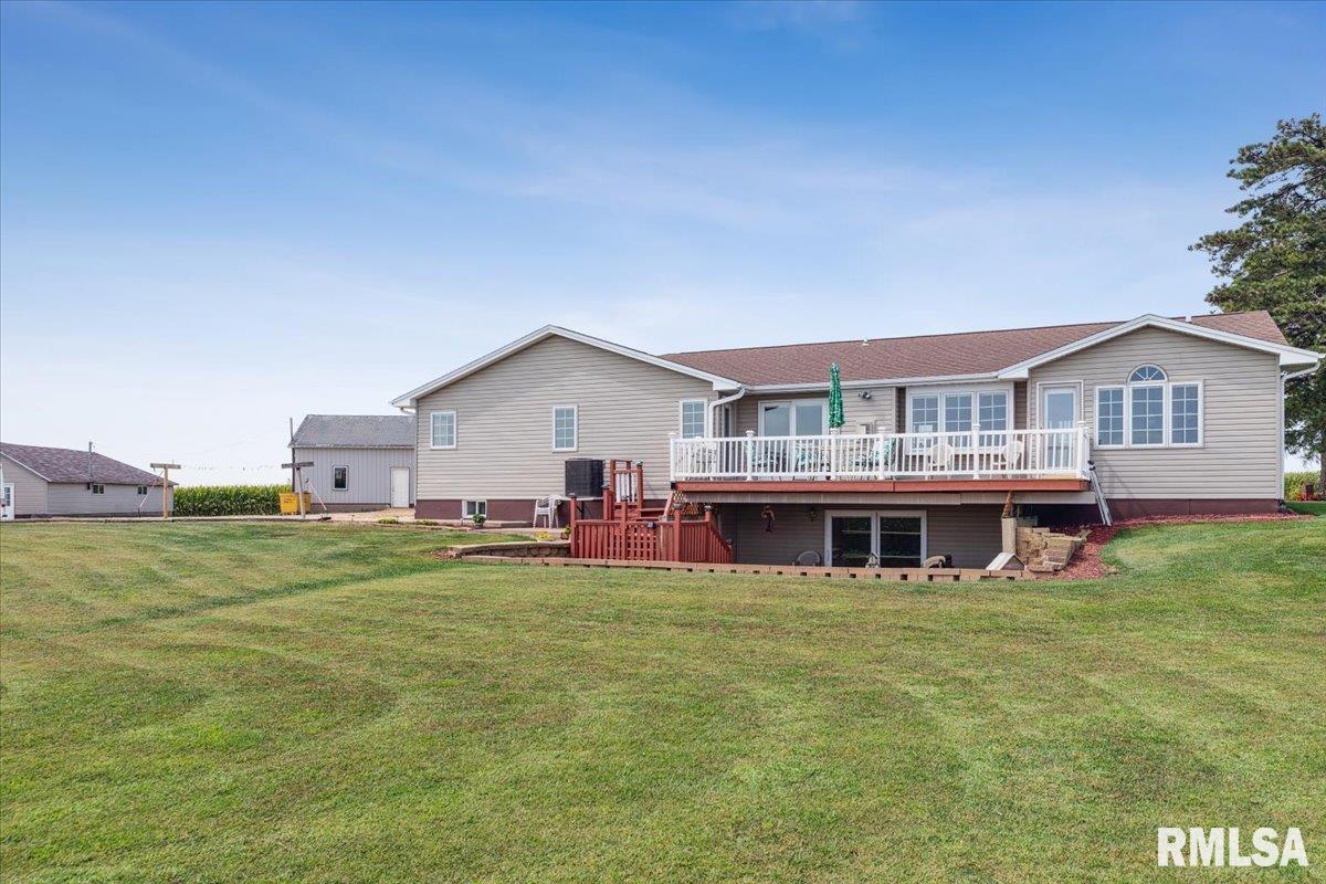 3983 120th Street Bryant, IA 52727 - Photo 4 of 62 a view of a house with a yard and sitting area