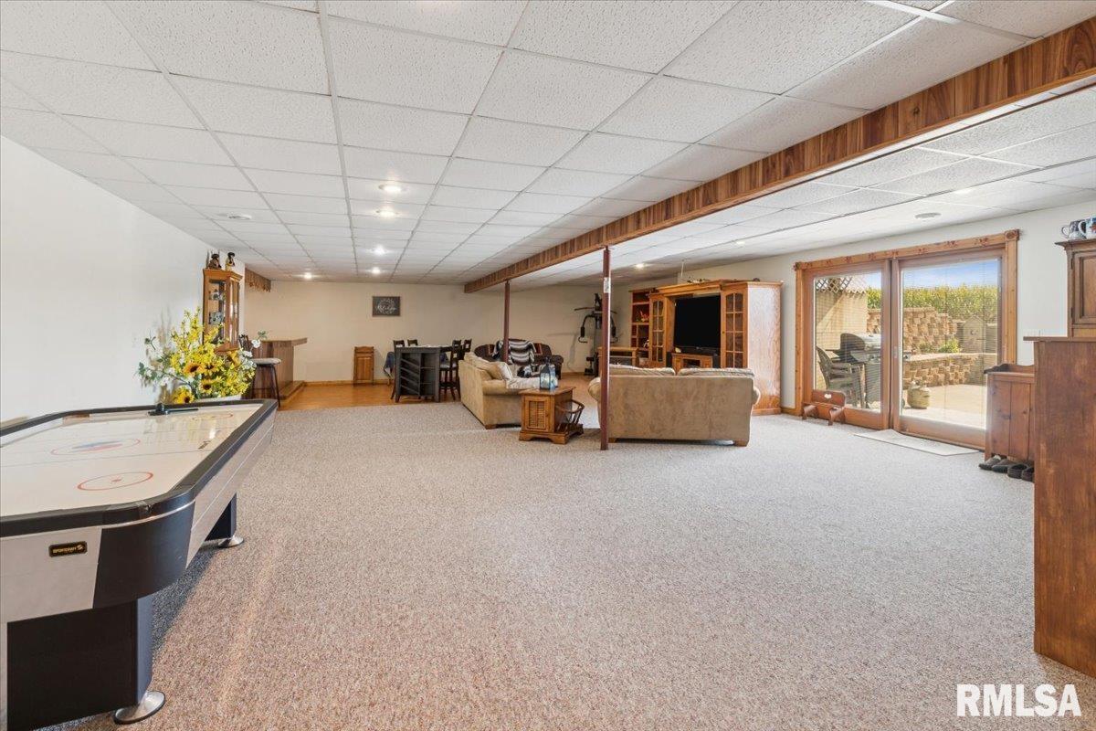 3983 120th Street Bryant, IA 52727 - Photo 42 of 62 a very nice looking room with furniture and a flat screen tv