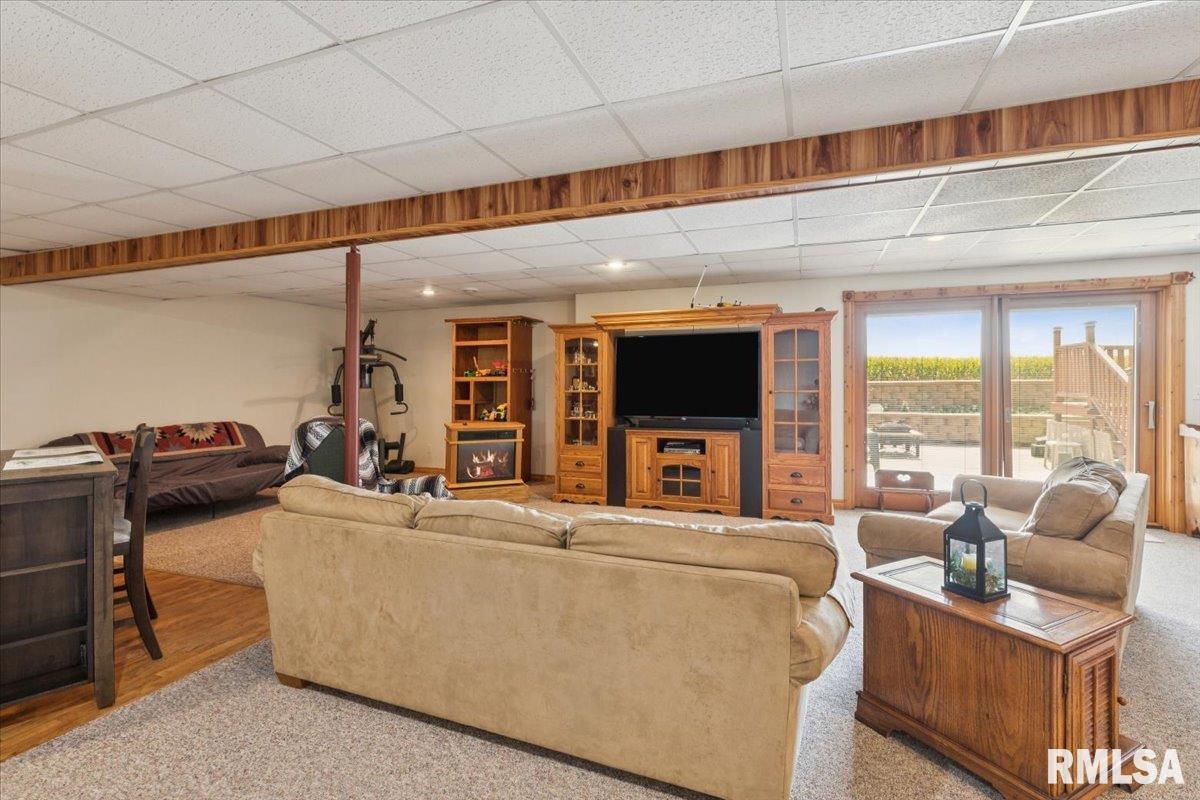 3983 120th Street Bryant, IA 52727 - Photo 43 of 62 a living room with furniture and a flat screen tv