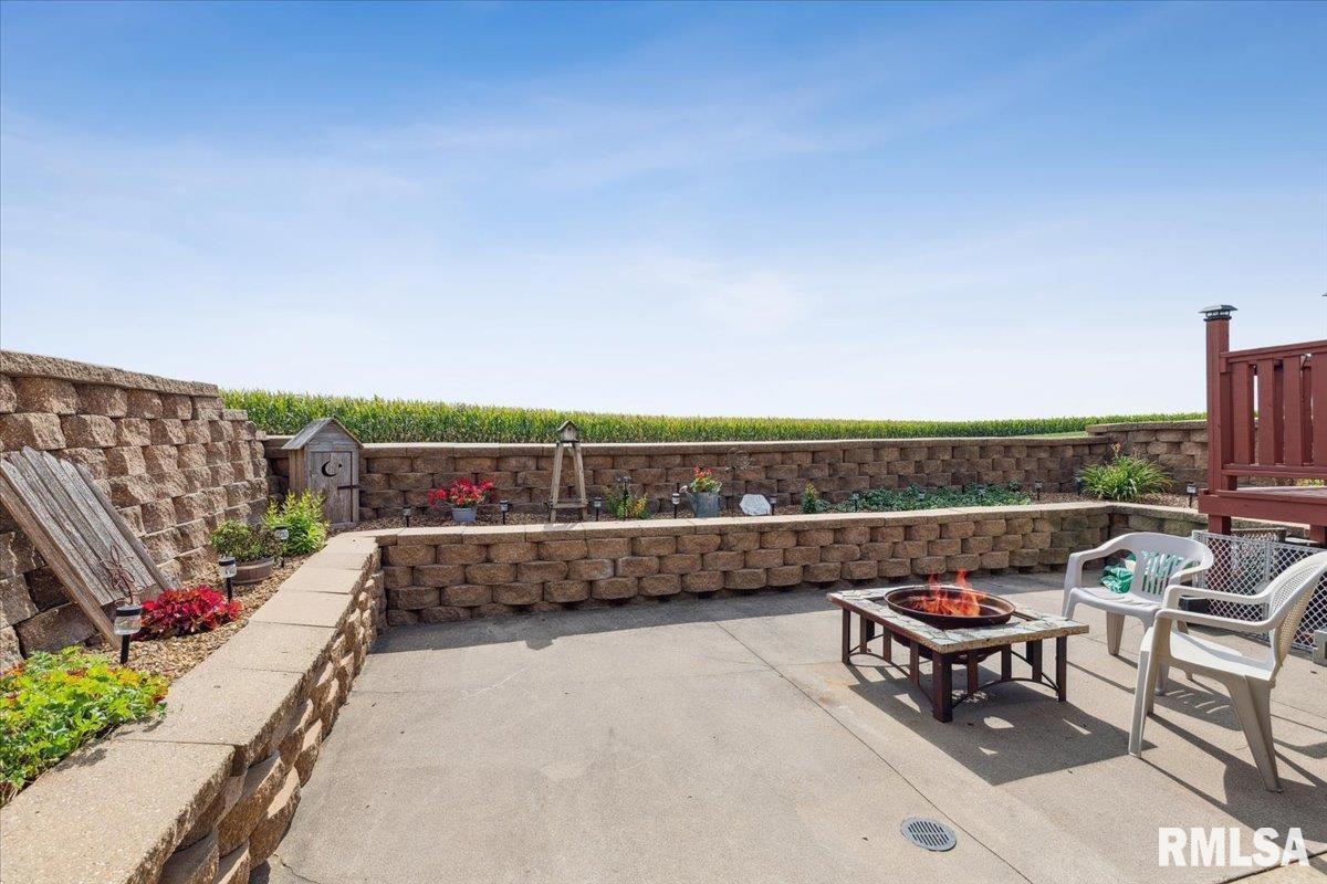 3983 120th Street Bryant, IA 52727 - Photo 45 of 62 a view of a terrace with chairs and bench