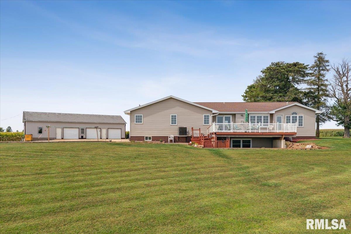 3983 120th Street Bryant, IA 52727 - Photo 5 of 62 a house with swimming pool in front of it