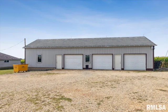 a view of a house with a yard and garage