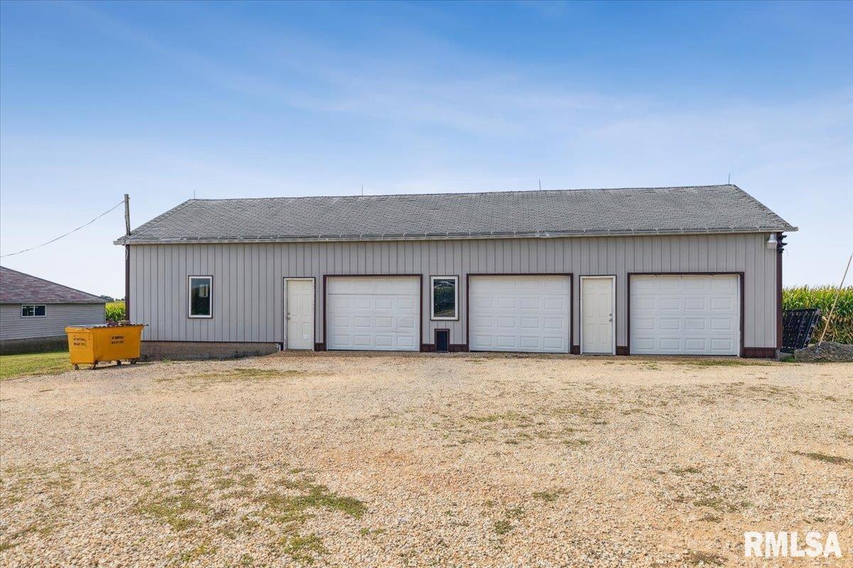 3983 120th Street Bryant, IA 52727 - Photo 6 of 62 a view of a house with a yard and garage