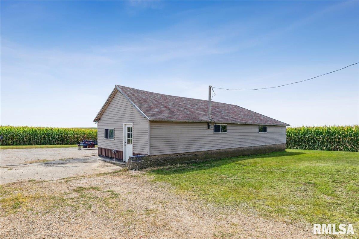 3983 120th Street Bryant, IA 52727 - Photo 7 of 62 a house view with a garden space