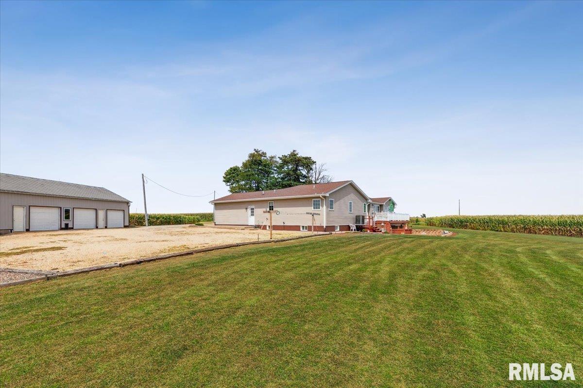 3983 120th Street Bryant, IA 52727 - Photo 9 of 62 a house with a yard