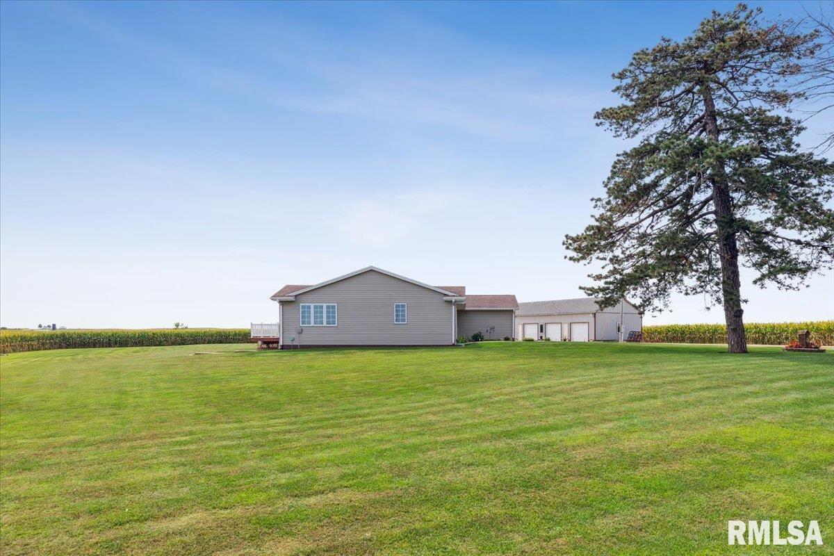 3983 120th Street Bryant, IA 52727 - Photo 10 of 62 a house with a field