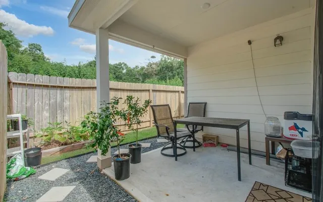 a view of a tables and chairs in patio