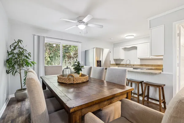 a dining room with furniture and window