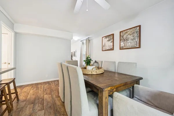 a view of a dining room with furniture and wooden floor