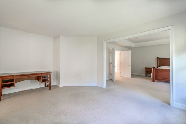 a spacious bathroom with a large tub shower and sink