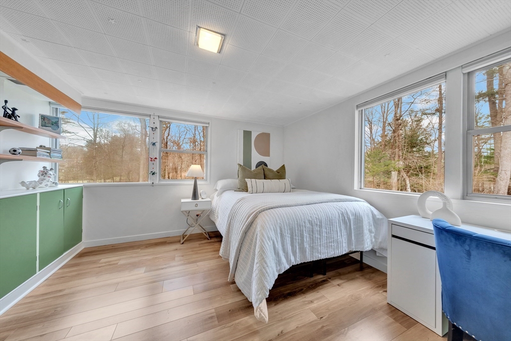85 The Valley Road Concord, MA 01742 - Photo 27 of 38 a bedroom with a large bed and a window