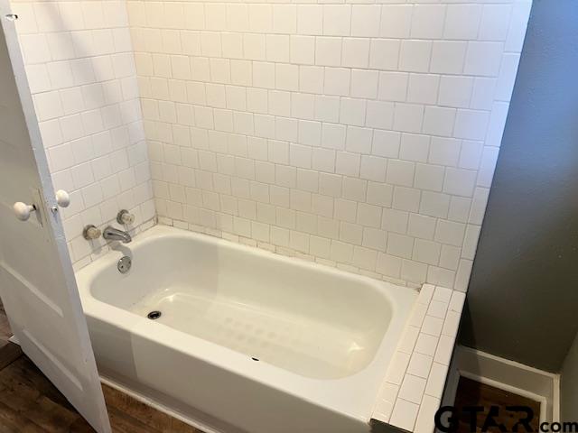 460 Pine Street Frankston, TX 75763 - Photo 11 of 13 a white bath tub sitting in a bathroom