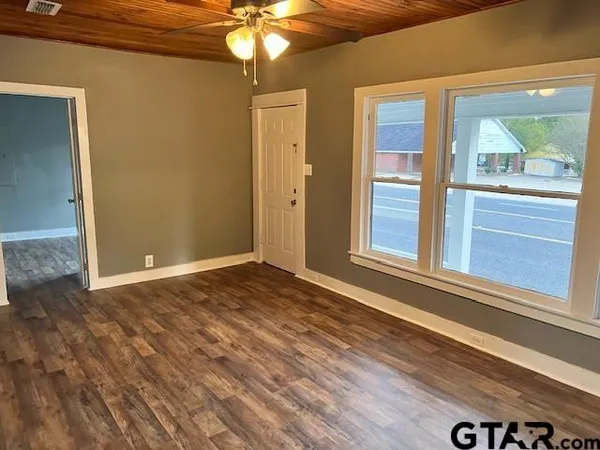 a view of an empty room with a window