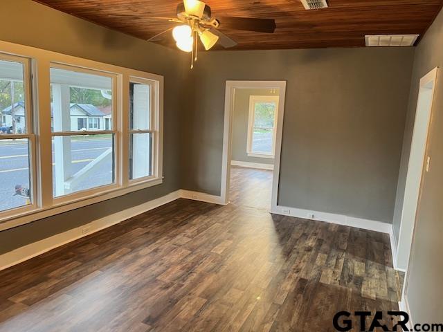 460 Pine Street Frankston, TX 75763 - Photo 3 of 13 a view of an empty room with a window and wooden floor