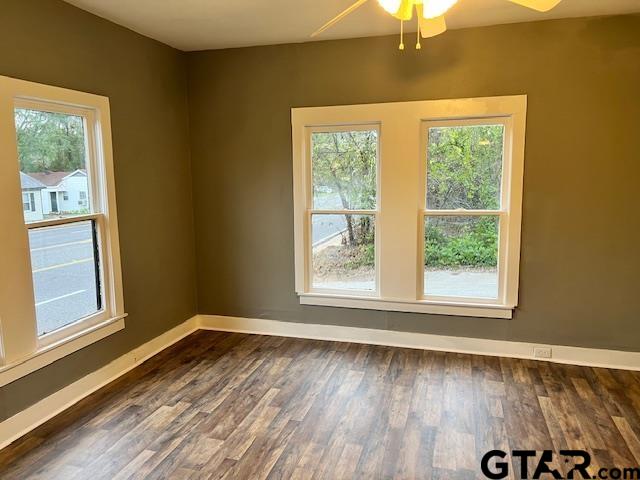 460 Pine Street Frankston, TX 75763 - Photo 6 of 13 an empty room with wooden floor and windows