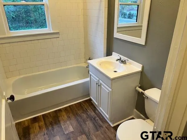 a bathroom with a sink a toilet a shower and a bathtub