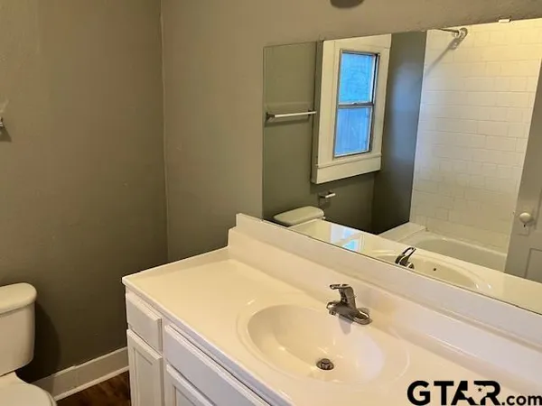 a bathroom with a sink and a vanity