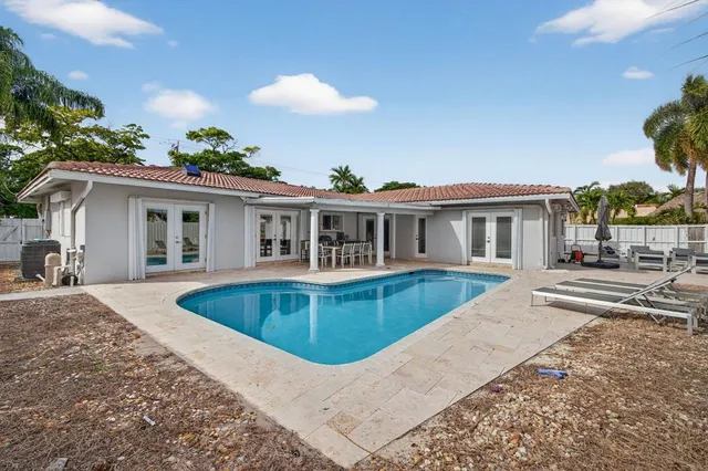 a kitchen that has a lot of cabinets in it and appliances