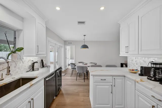 an aerial view of multiple houses with yard