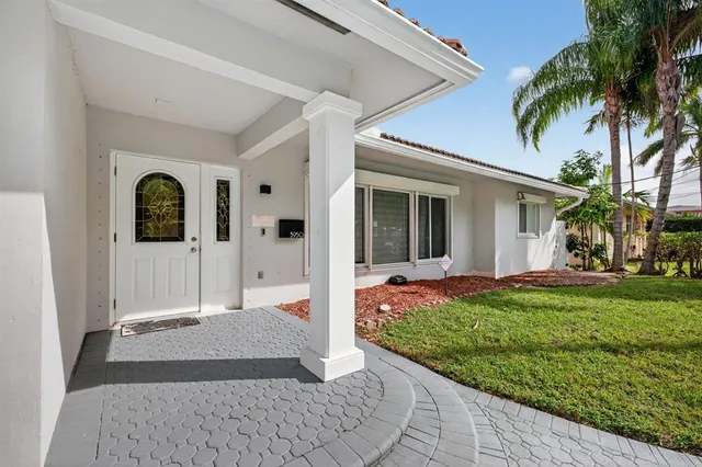 a view of a lake with couches chairs and city view