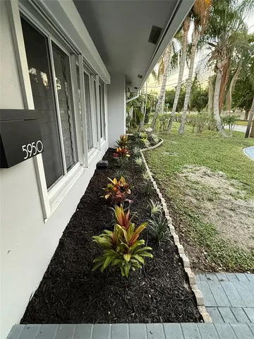 a view of a lake with couches and city view