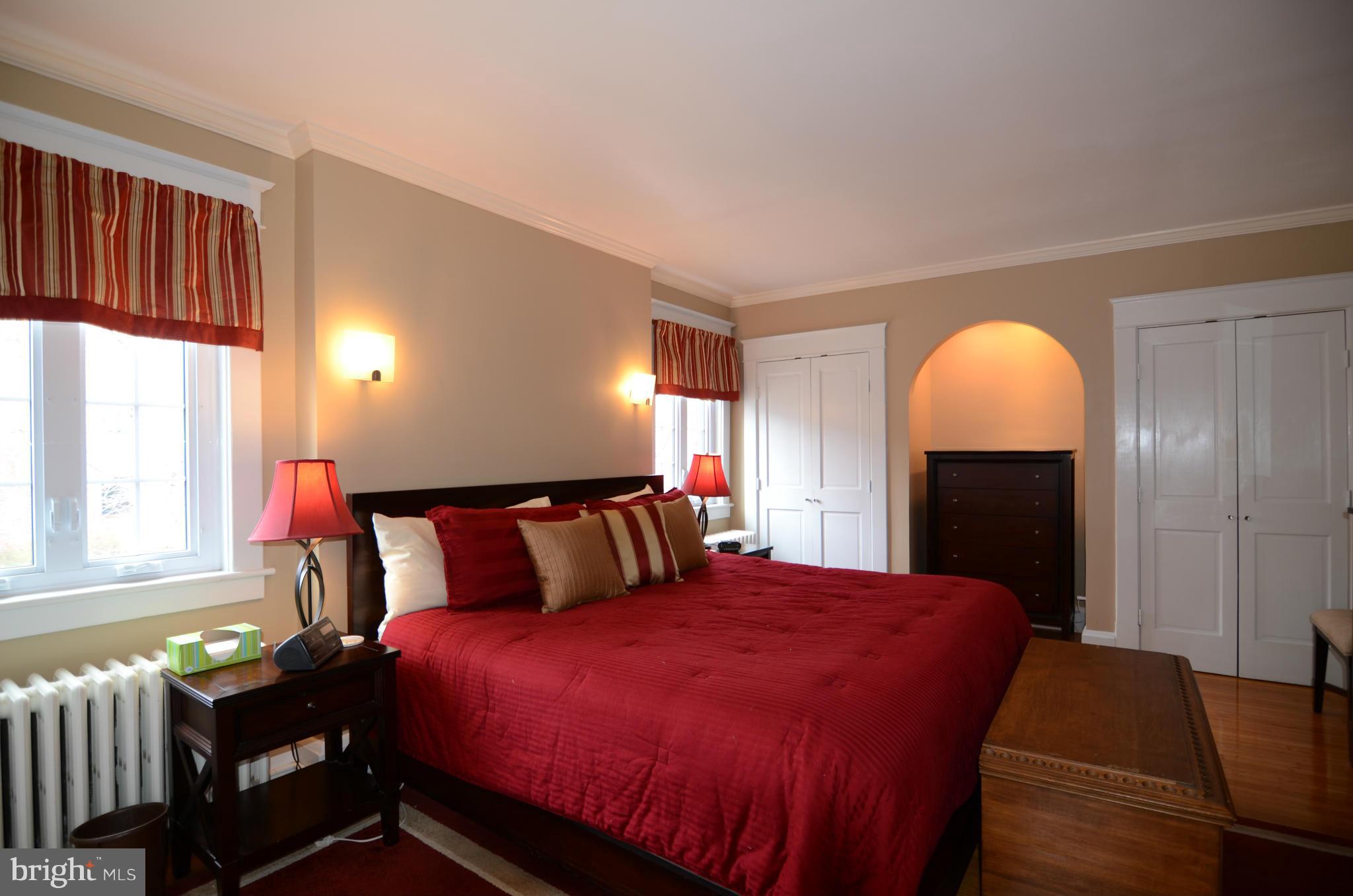 4425 Wickford Road Baltimore, MD 21210 - Photo 12 of 28 a bed room with a bed and a lamp