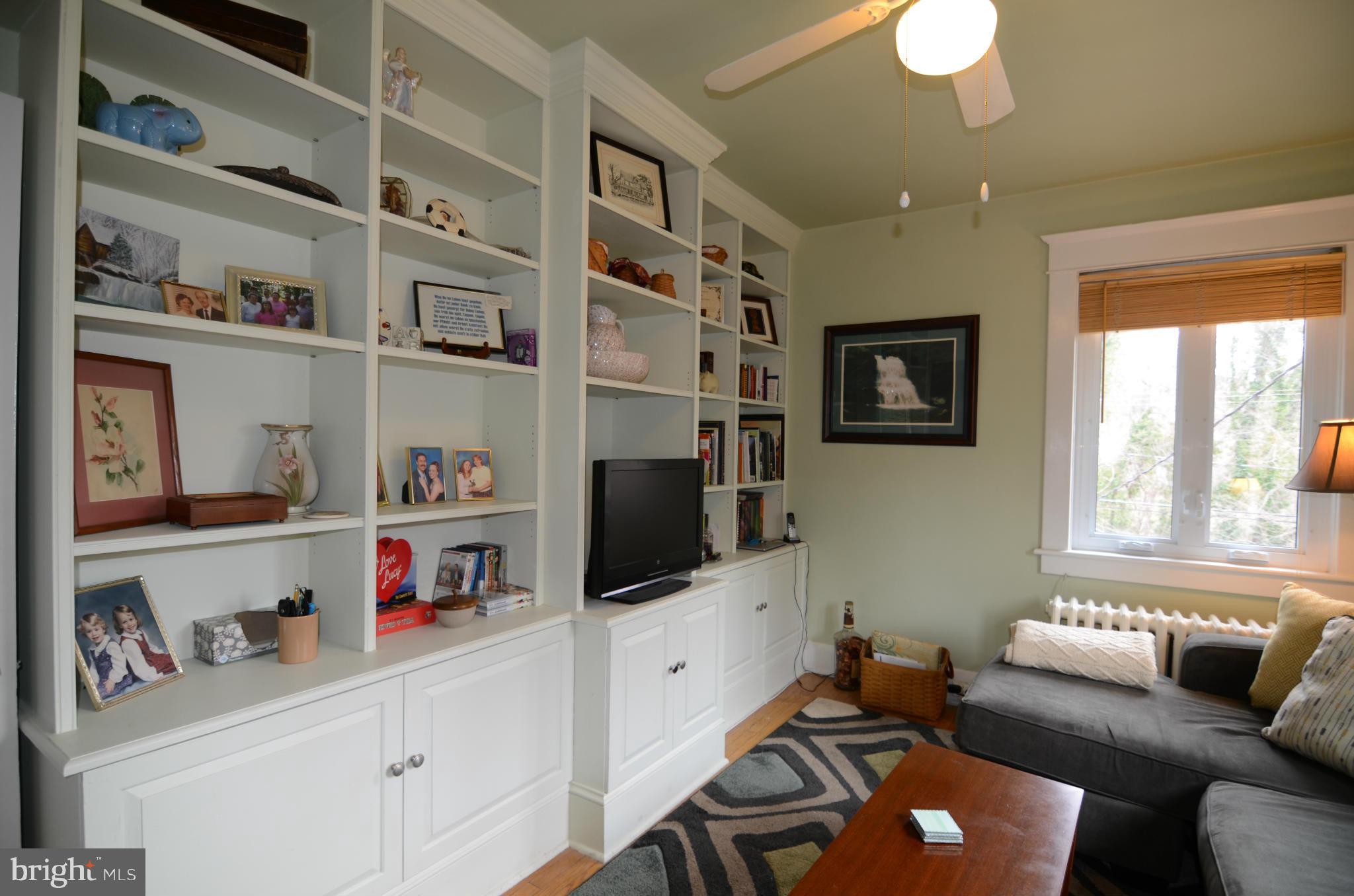 4425 Wickford Road Baltimore, MD 21210 - Photo 15 of 28 a living room with furniture cabinets and a flat screen tv