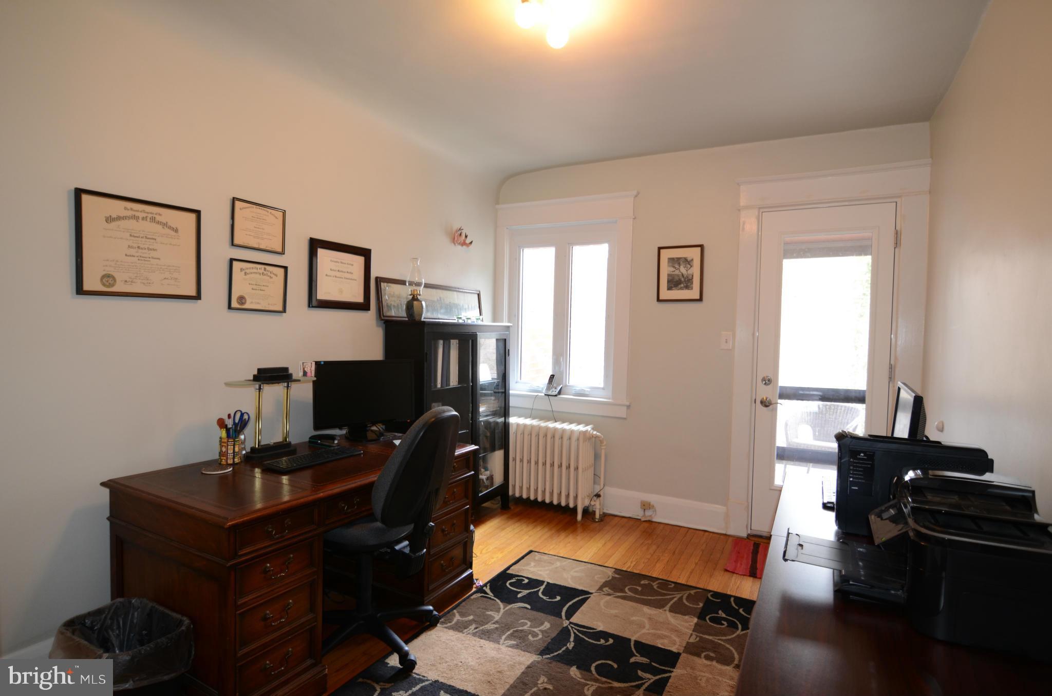 4425 Wickford Road Baltimore, MD 21210 - Photo 17 of 28 a view of a workspace with furniture and a window