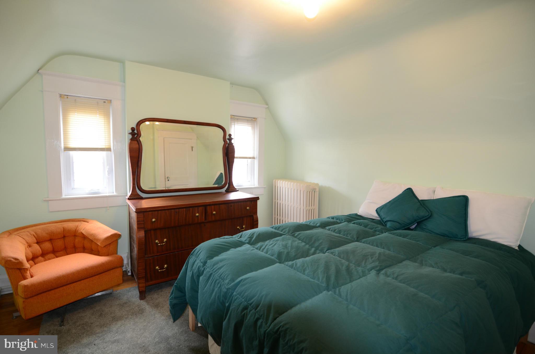 4425 Wickford Road Baltimore, MD 21210 - Photo 19 of 28 a living room with a bed and a couch
