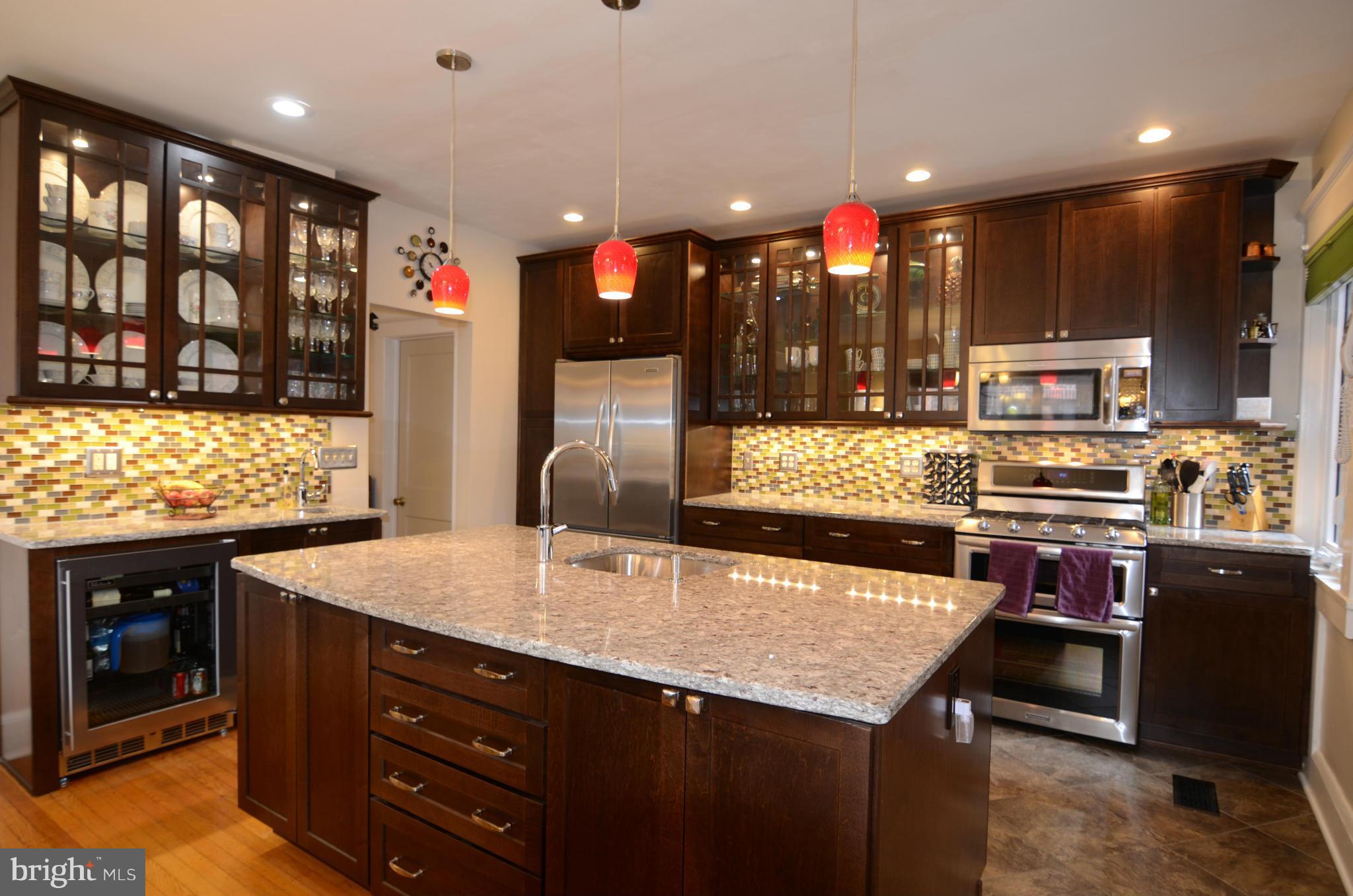 4425 Wickford Road Baltimore, MD 21210 - Photo 7 of 28 a kitchen with a stove a sink and a refrigerator