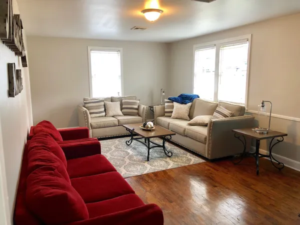 a living room with furniture and a window