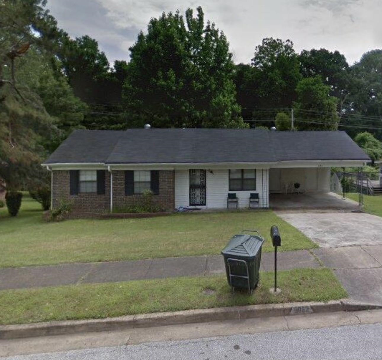 3082 Spring Hill Drive Memphis, TN 38127 - Photo 1 of 15 a front view of a house with a garden