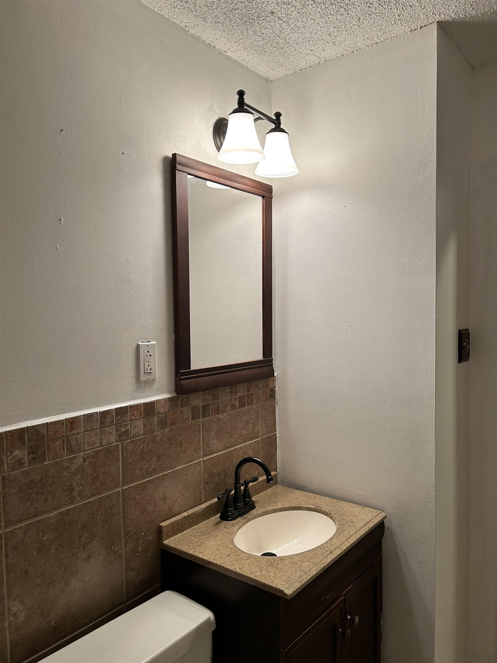 3082 Spring Hill Drive Memphis, TN 38127 - Photo 14 of 15 a bathroom with a toilet sink and mirror