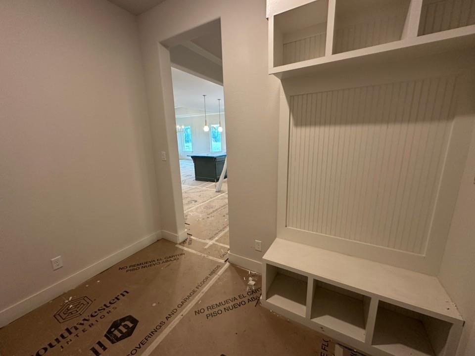 585 Brown Road Leonard, TX 75452 - Photo 20 of 29 Built-in mudroom bench with beadboard backing, overhead shelving, and lower cubbies